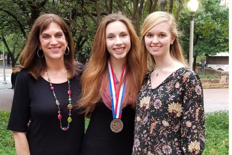 UIL journalism coach Laura Smith celebrates with junior Erin Sheffield, who won a silver medal, and sophomore Macy McClish after both competed in the State UIL Academic Meet in Austin May 4.