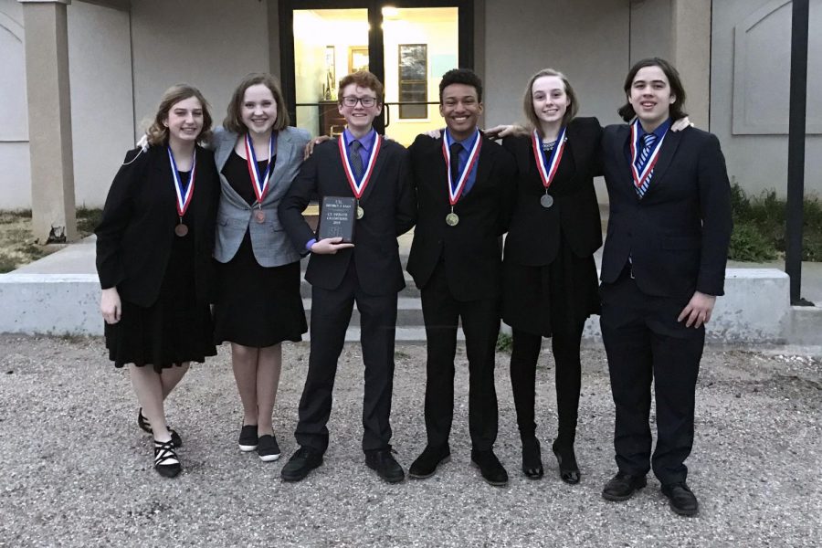 The three state-qualifying cross-examination teams celebrate their new medals.