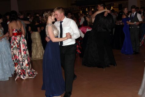 Senoir Caden Zotter and graduate Kelly Wegman dance at last years prom. 