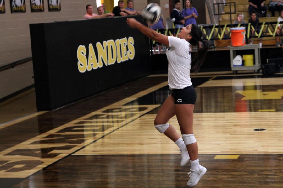 Junior Bryli Contreras returns the volleyball in the varsity teams game against the Amarillo Sandies.