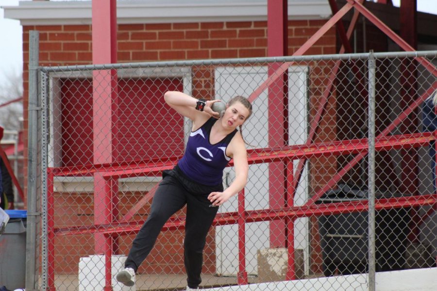 Audrey Hughes throws the shot put at the Plainview track and field meet. 