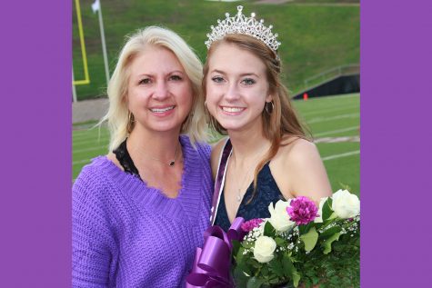 Jacque Green congratulates daughter Lily Green on the sidelines after Lily was crowned homecoming queen prior to the football game against Big Spring.