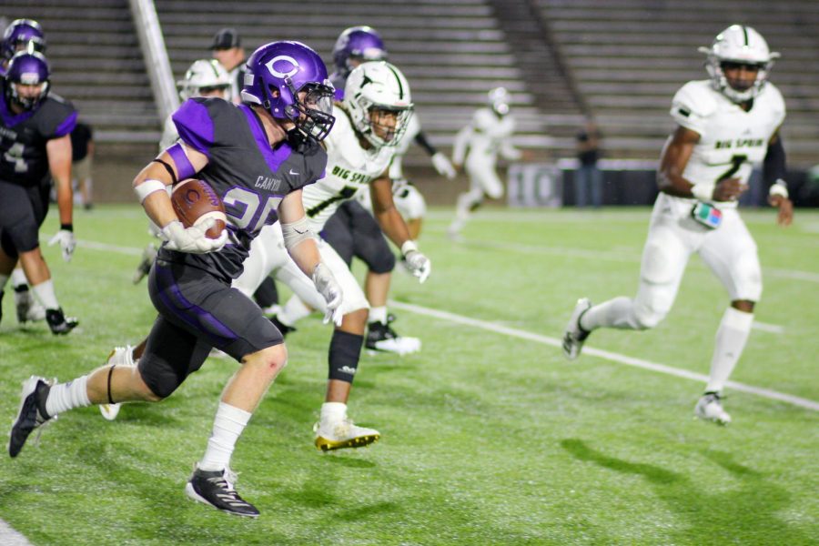 Sophomore Ethan Cowan carries the ball in the teams victory over Big Spring.