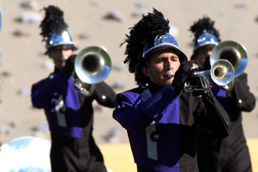 Senior Bret Ramirez marches trumpet, one of many instruments he plays including guitar and piano.