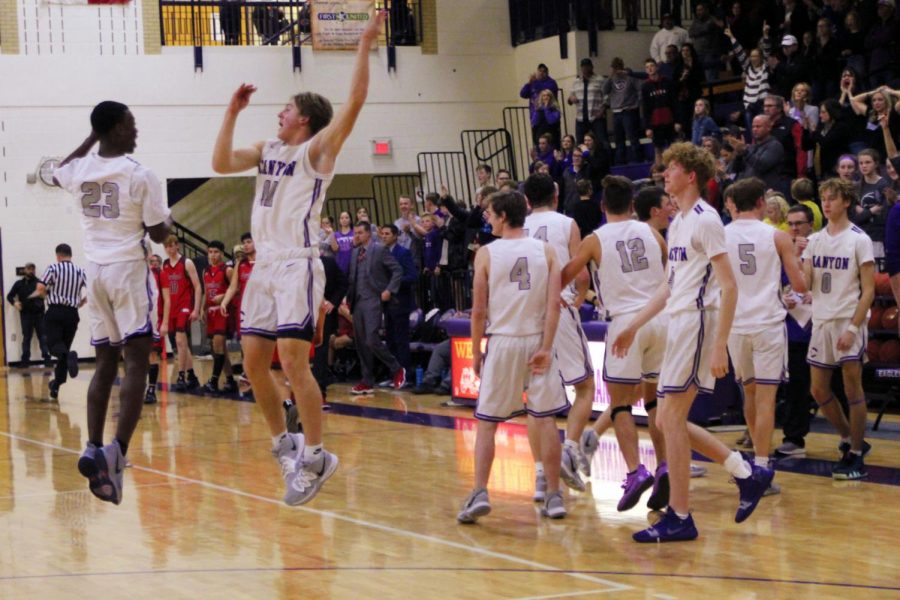 The boys basketball team celebrates their win against Levelland in the their Jan. 17 game. After a loss to Levelland Feb. 2, the Eagles defeated the Lobos again Feb. 21 to claim the district title.