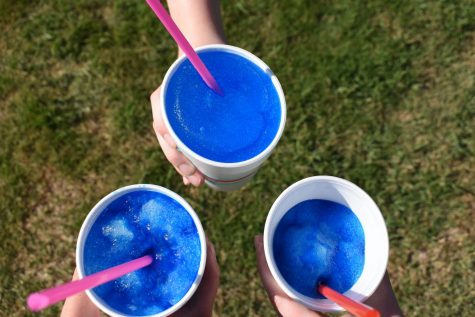 Four staffers got together to compare the blue coconut-flavored snow cones from Sonic, SnoBall Stop and Oasis.