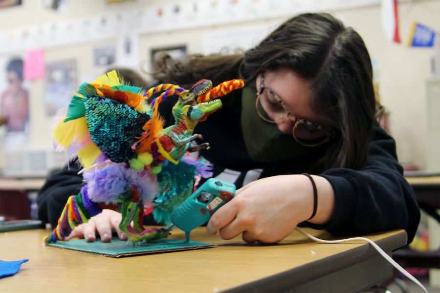 Senior Elizebeth Daeley works on her project for Wayland Baptist University’s Language and Culture Festival in AP Spanish IV. Students have the option to perform skits, poetry reading, extemporaneous speaking, dance, music, art and songs. Daeley created an alebrije, a mythical spirit guide in Hispanic cultures. I didnt want to make a traditional project, Daeley said. I wanted to be more fun and creative. I decided to create a dinosaur parrot bunny. I enjoy this class; its fun learning about my own culture.