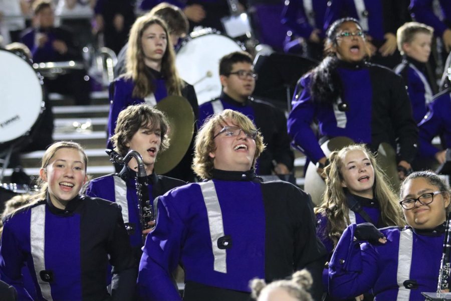 Barrick Hughes is in the stands at a Friday night football game, surrounded by his fellow band members.