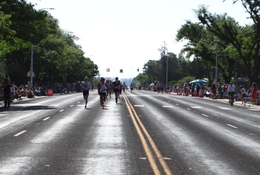 Coach Wesley Kirton riding alongside his team at the fourth of July parade. “You’re gonna have to take yourself out of the moment for a second and, and assess the demand in front of you, and make a concerted effort,” Kirton said. “Take a little bit at a time, and just keep working until you’re stronger or you’re doing your best with whatever situation is.”