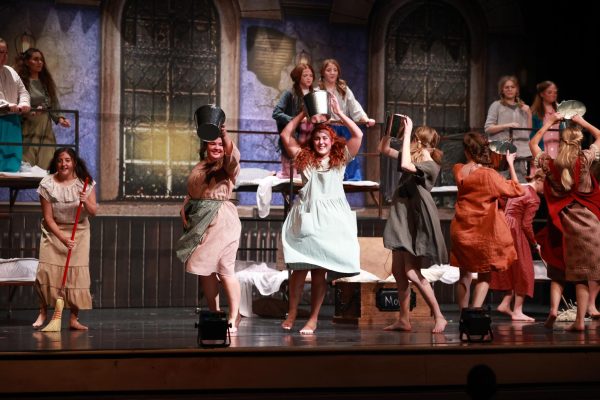 Junior Aubrey Webb performs as Annie during the song, Hard Knock Life. 