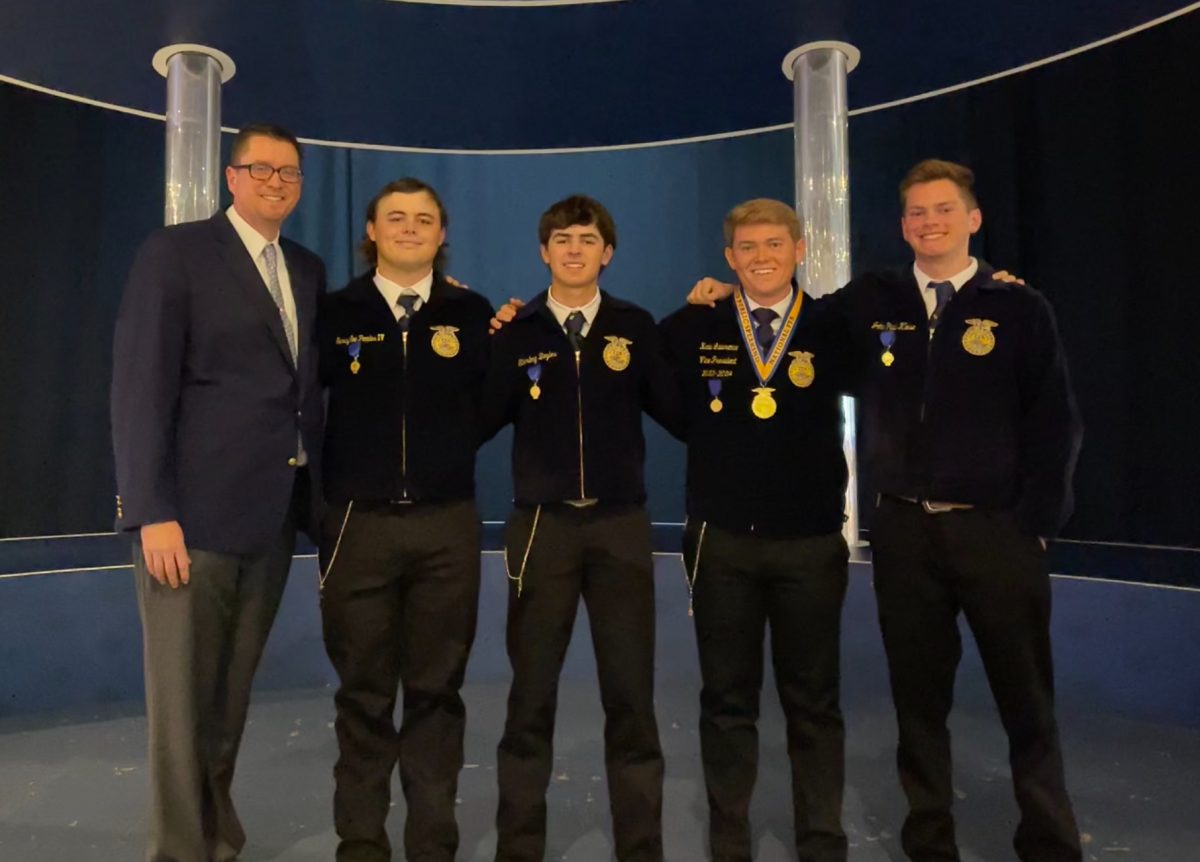 The FFA team that competed in Nationals stand for a photo after a successful day. “Entering nationals, all youre thinking is the contest this week and you need to win,” senior Kade Lawrence said. “Just a mix of emotions. And its a big conference. Youre the representative for the state of Texas.”