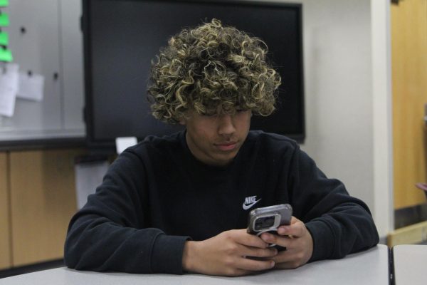 Sophomore Adam Bergara Scrolls on Instagram during class. 