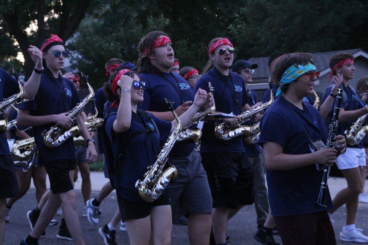 Junior Zannah Dorsey sings and dances along to a drum cadence. “March-A-Thon, even though it seems the hardest thing you’ll do in marching band, is the thing that brings the band together,” Dorsey said. “The people in band mean so much to me. They’re my best friends, brothers and sisters. Marching along with upperclassmen I’ve looked up to, marching with my best friends, and also marching with the freshman is such a powerful thing. You don’t know who's a freshman and who's a senior, we're all just band people who happen to be marching at the same time."