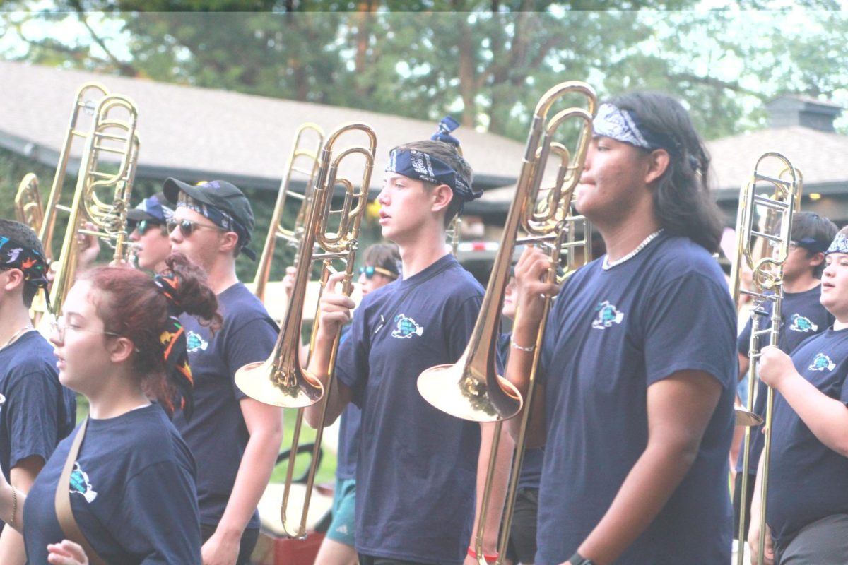 Junior Jackson McCord marches beside friends in the March-A-Thon. "March-A-Thon isn't that bad," McCord said. "I was with my friends, so we were making jokes the whole time. Me and my friend Max Bliss on the left were having lots of fun. Band is fun."