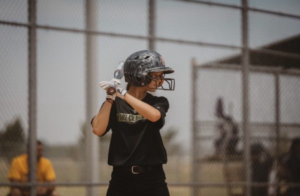 Freshman Kinleigh Christian stands at bat 