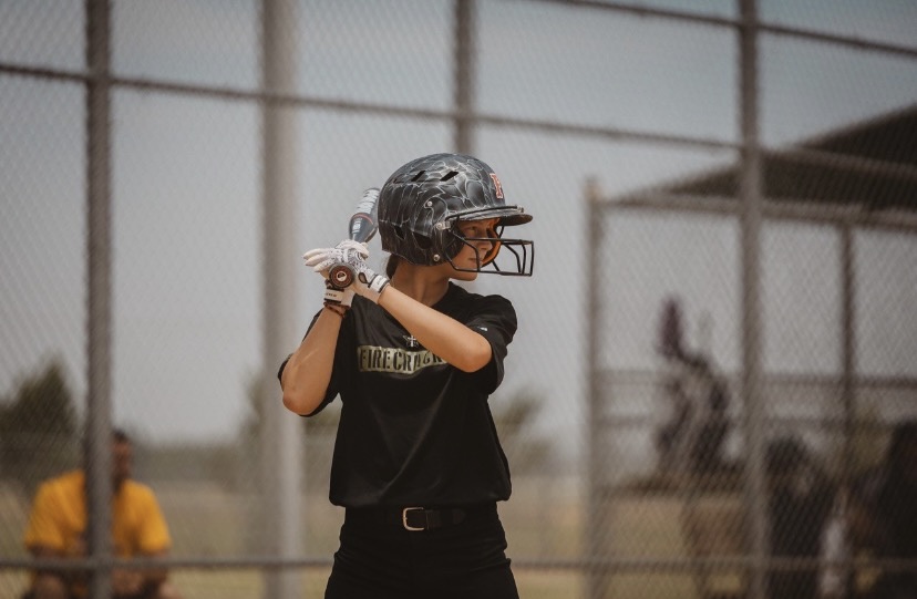 Freshman Kinleigh Christian stands at bat 