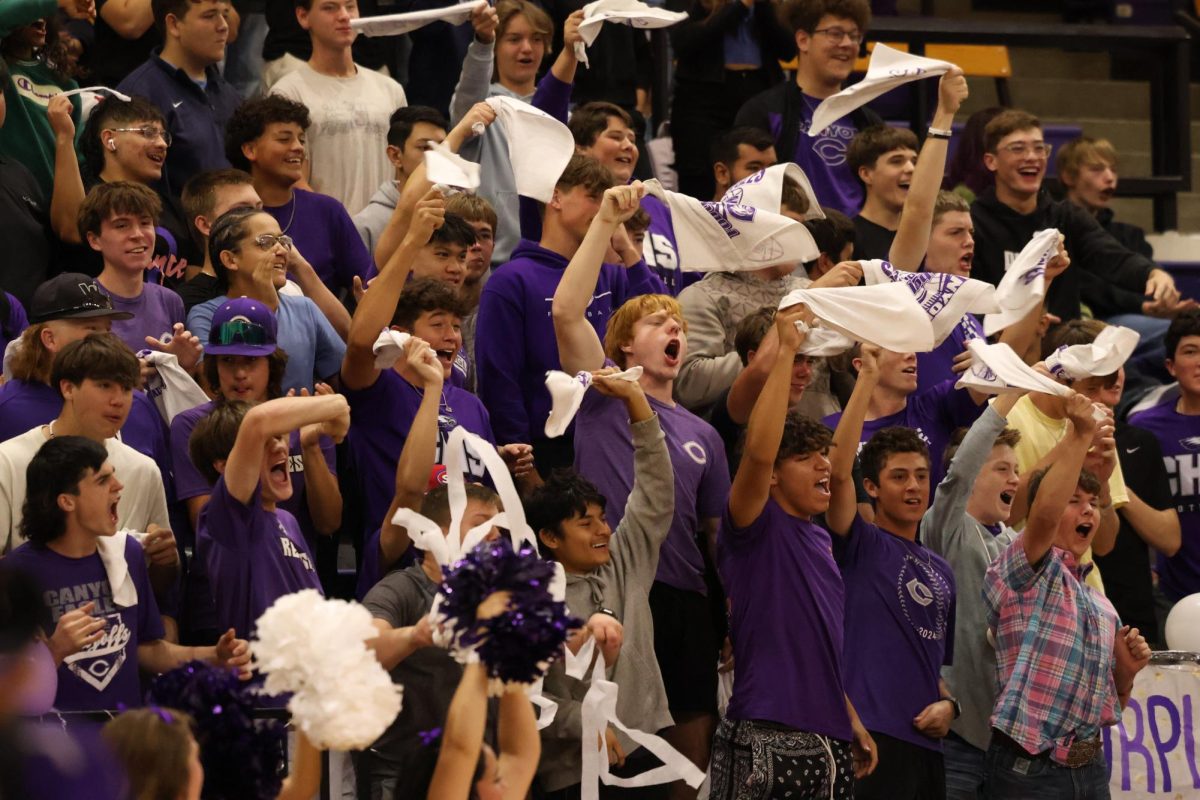 Sophomore, Creed Miller, cheers during the Purple Out pep rally. “As a sophomore, it helps that you win during the pep rally, but at the end of the day it’s still just a pep rally,” Miller said. “My homecoming was pretty fun. I went to a bunch of my friends' houses. Then I just found ways to stay out of trouble.”