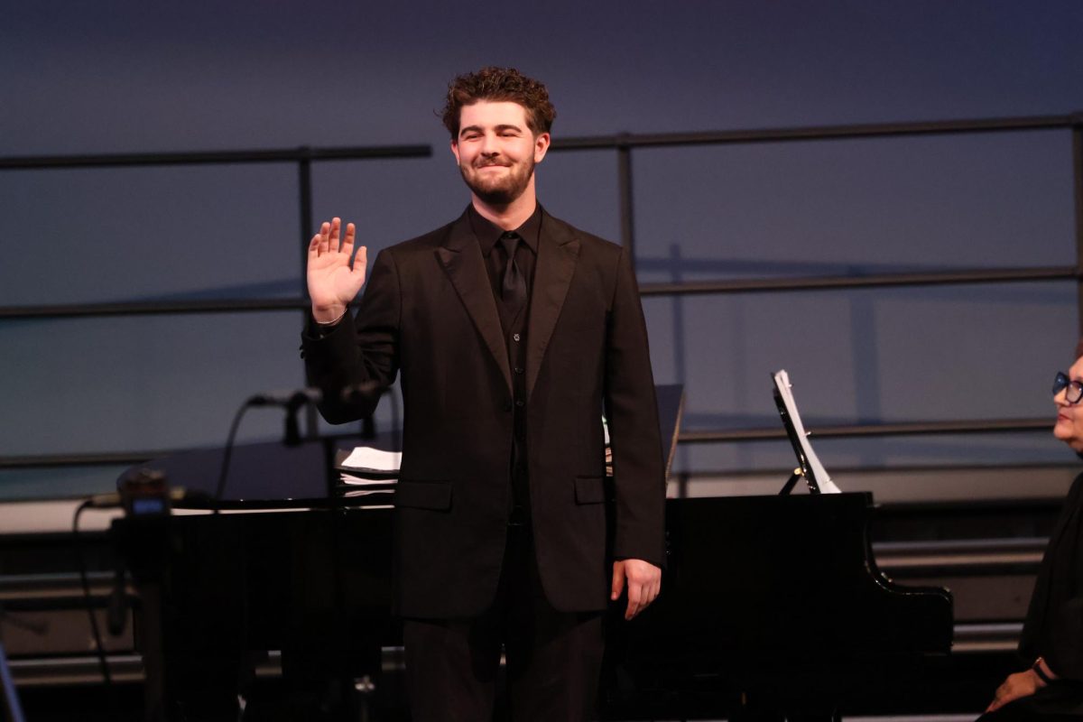 Senior Trace Thomas performs at the December Choir Concert. "I like to think of each song as different journeys leading to the same destination," Thomas said. "The destination is to express importance, I believe this is why music is so special.”