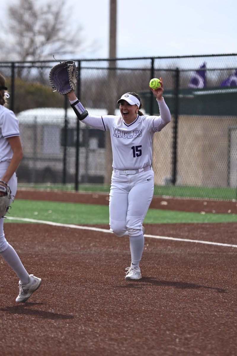 Senior, first baseman, Maddie Hight celebrates out on first base.