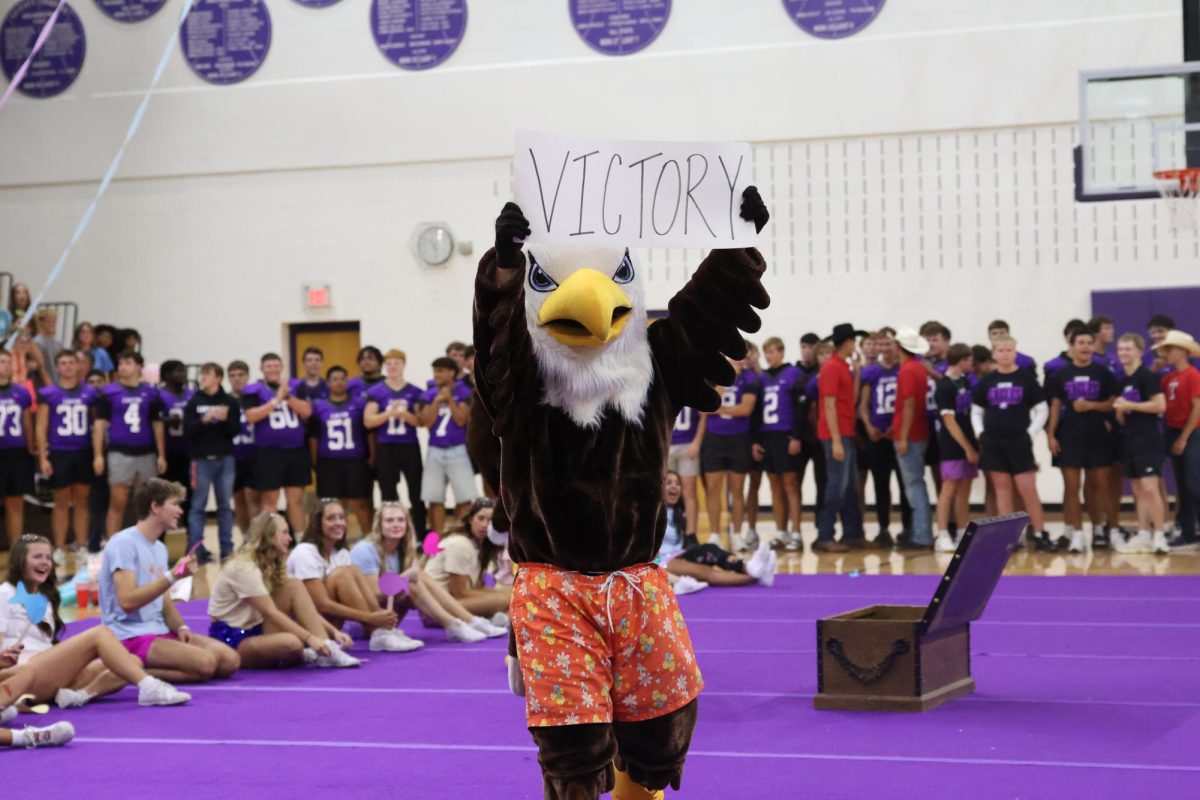 The eagle holding a sign the reads "Victory".