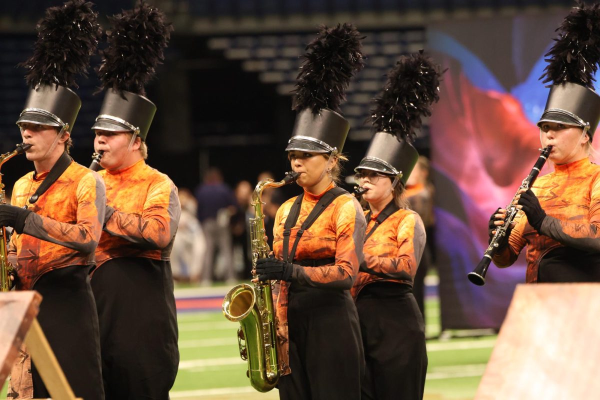 Senior Max Bell,  senior Jerry Sixberry, sophomore Maggie Ramirez, senior Zannah Dorsey and sophomore Bailey Zapata perform Nomadic at the STATE UIL Marching Band Contest.