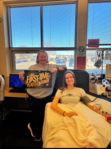 Libby Wagner (12) poses for a photo while she donates